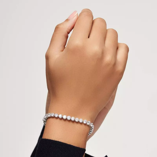 A close-up of a diamond tennis bracelet