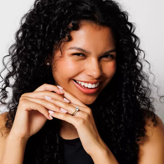 Woman with diamond engagement ring and wedding band