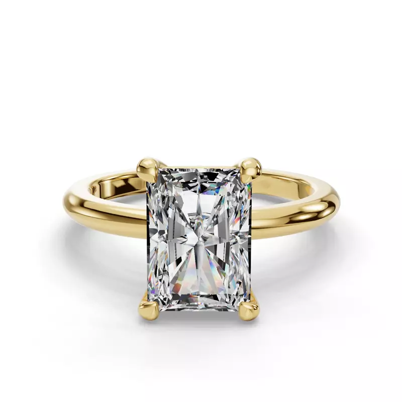 a radiant center stone with emerald cut flanking it. 3 stone