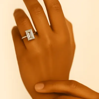 Rare Carat's ideal proportions for an emerald cut diamond, highlighting symmetry, polish, girdle, table, depth, and clarity