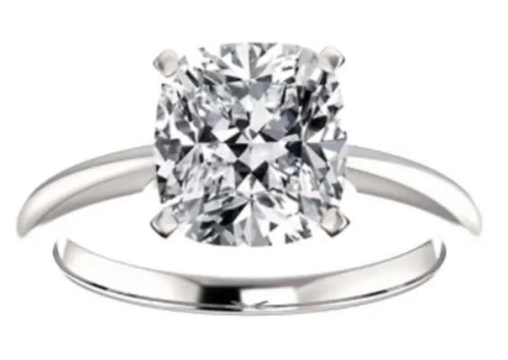 cushion cut diamond set in white gold solitaire prong setting