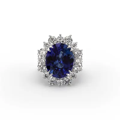 a blue oval sapphire center stone surrounded by a halo of diamonds 