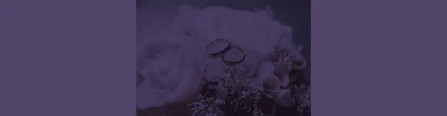 blog header boquett of flowers with wedding rings on top