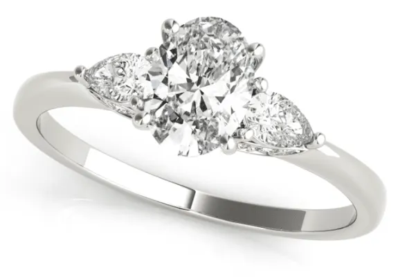 A three stone oval ring setting with pear shaped sides shown in white gold