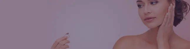 Blog header woman looking at engagement ring