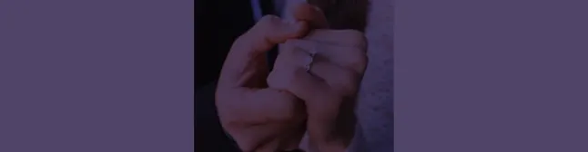 holding hands with engagement ring