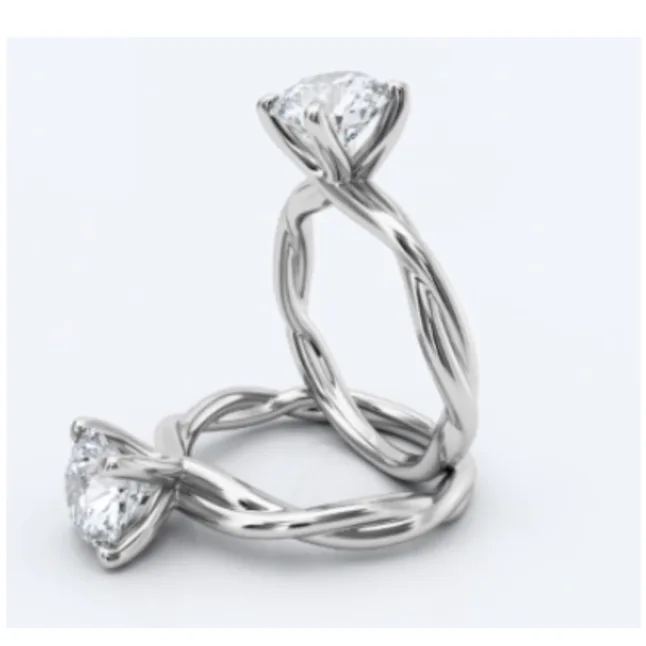 A twisted shank ring in white gold - round solitaire 
