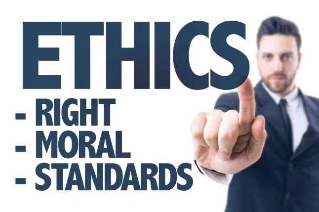 Image of the words ethics, right, moral, standards in bold with man standing besides them 