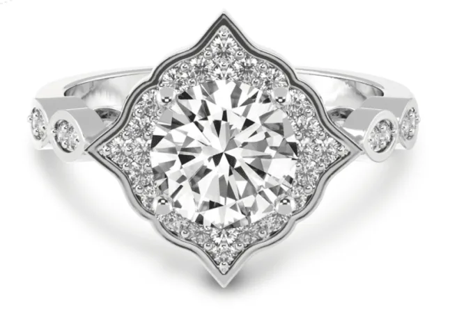 Image of vintage halo diamond setting in white metal with accent diamonds