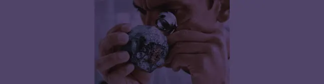 blog header man looking with loupe