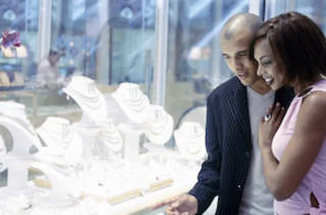 Image of a couple window shopping for jewelry 