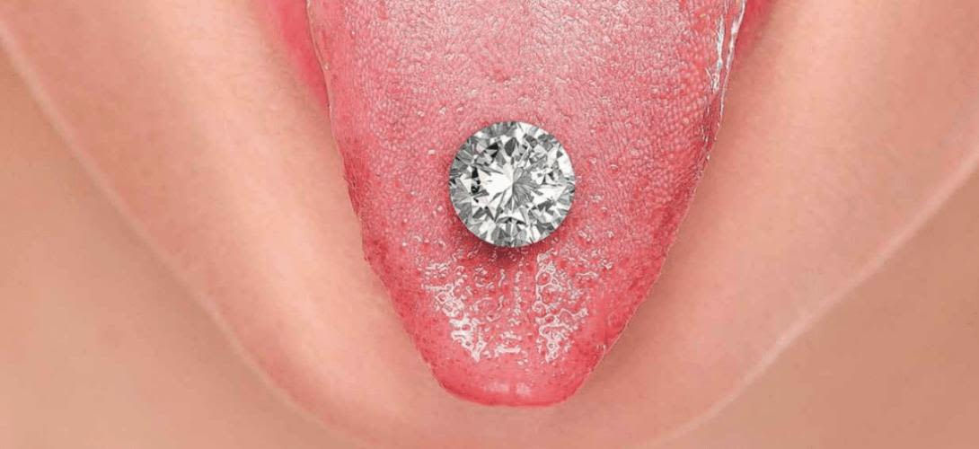 A close-up of a diamond worn as a tongue piercing