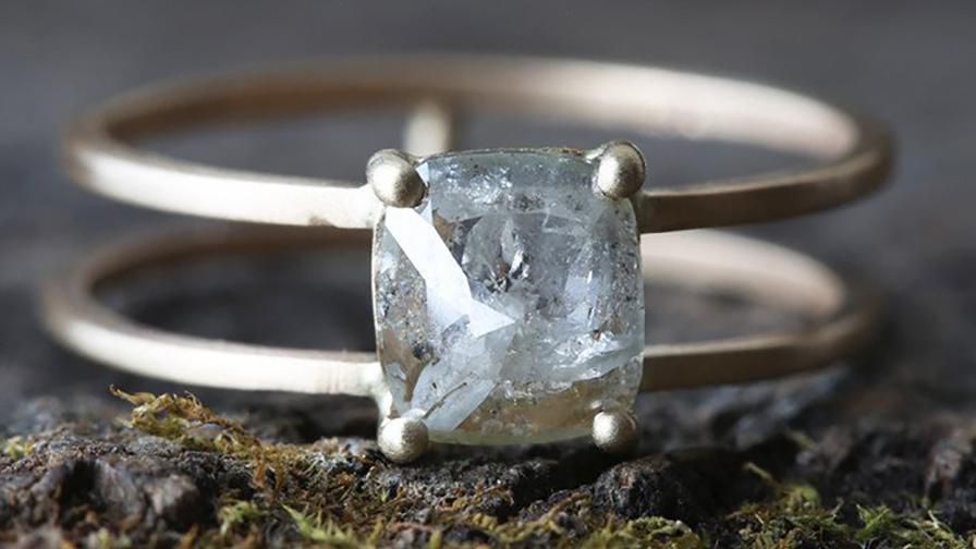 4 prong ring with a polki diamond in a silver setting