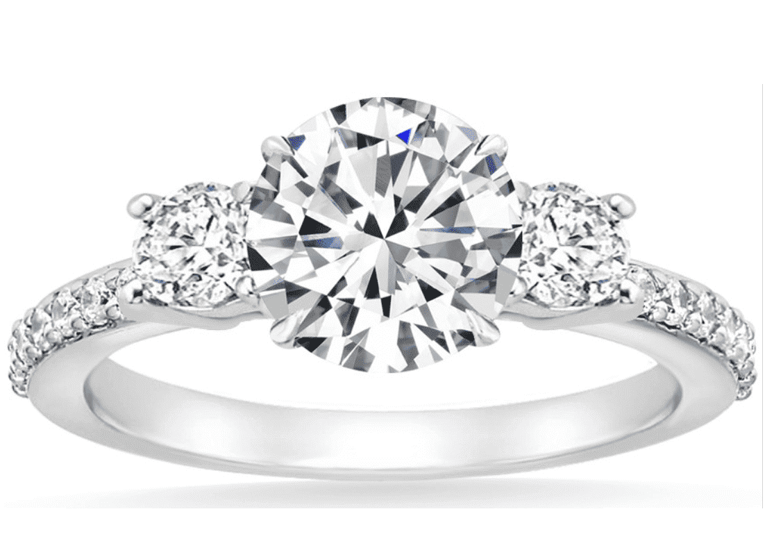 three stone round diamond ring with pave set in white metal