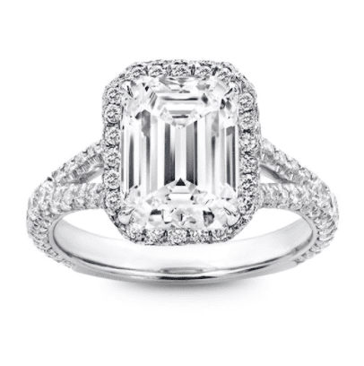 An emerald cut diamond ring in split shank band setting