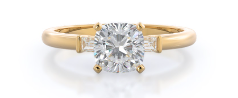 three stone cushion cut diamond ring in yellow gold
