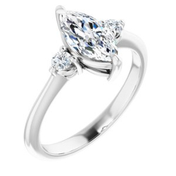 three-stone diamond ring with a marquise cut diamond set in the center