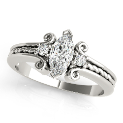 three-stone diamond ring with a marquise cut diamond as the center stone and twisted rope band design