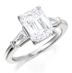 emerald center stone in a tapered baguette 3 stone ring