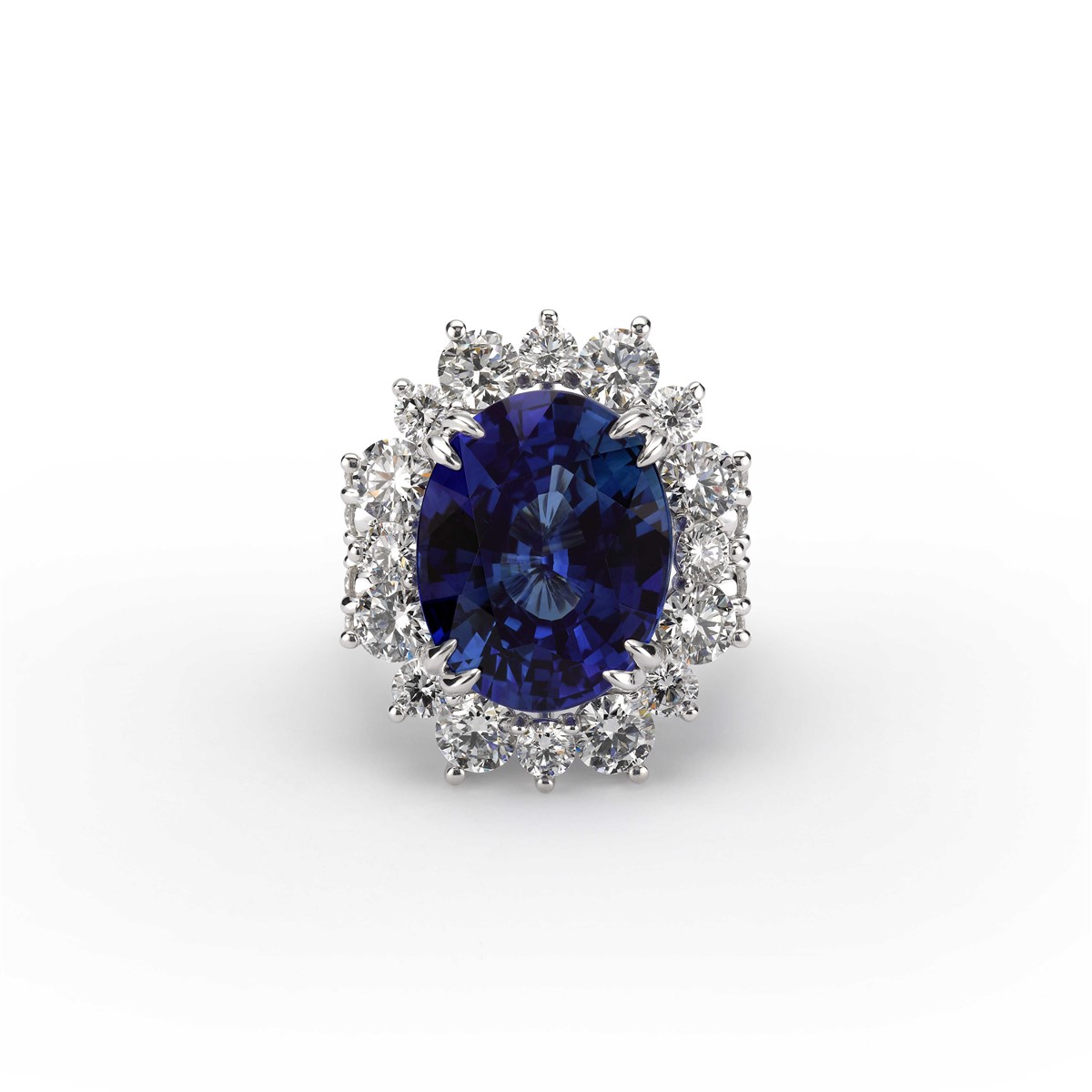a blue oval sapphire center stone surrounded by a halo of diamonds