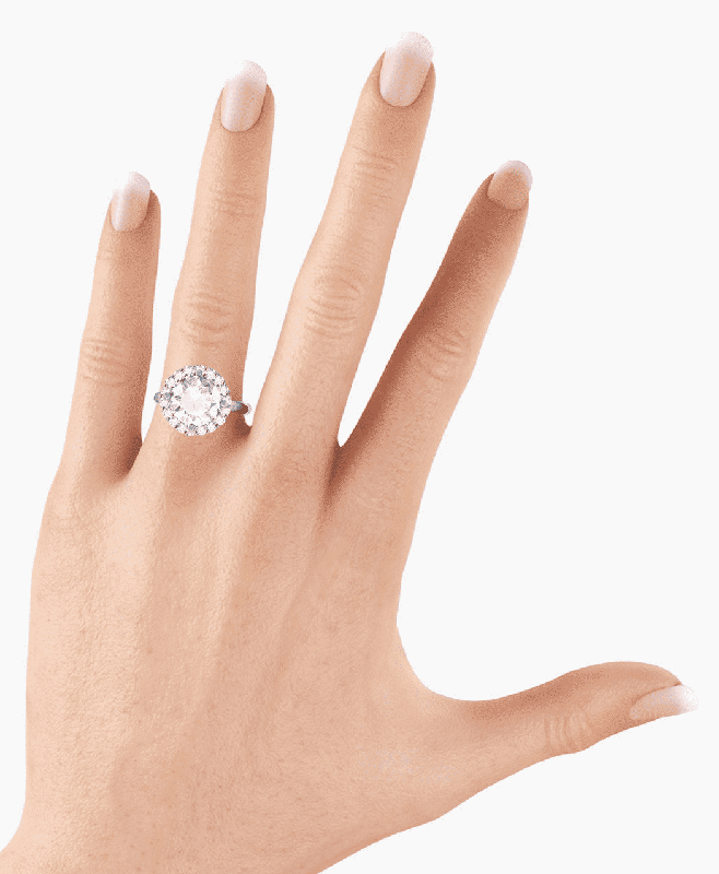 A diamond ring worn on the fourth finger of a woman's left hand