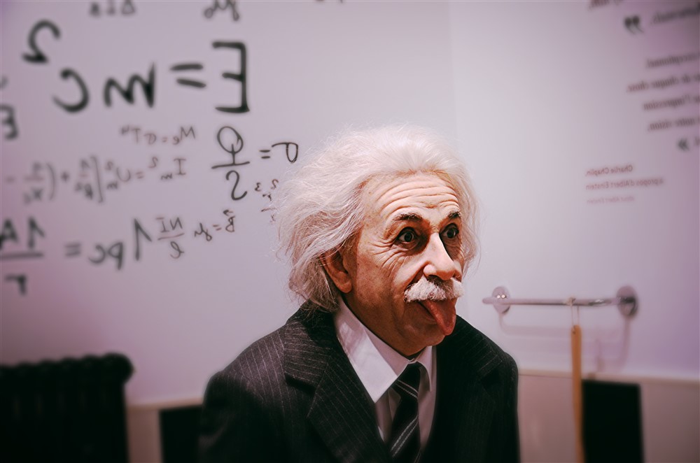 A wax figure of Albert Einstein playfully sticking out his tongue, capturing his iconic expression