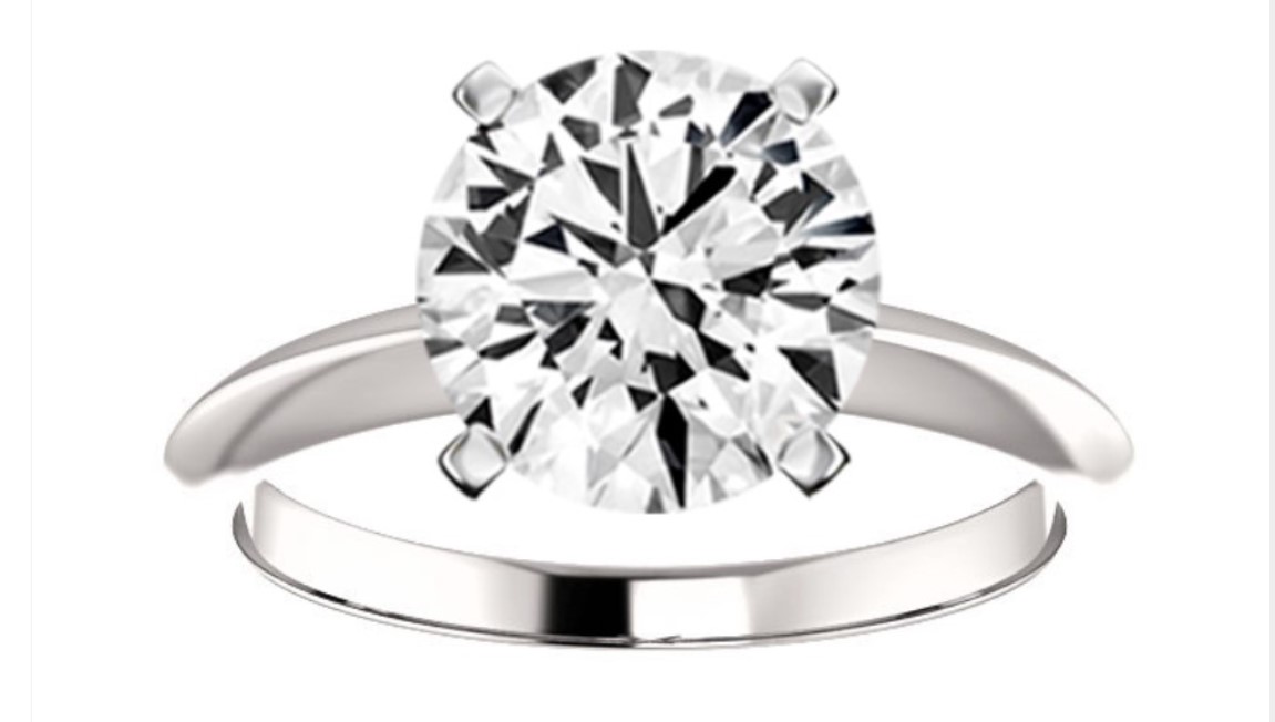 4 prong white metal solitaire round diamond ring