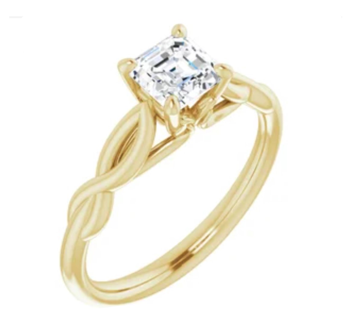 A diamond ring in yellow gold setting