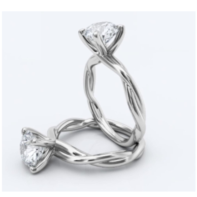 Two diamond rings with twisted shank setting