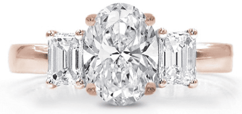A three stone oval diamond ring set in a rose gold setting