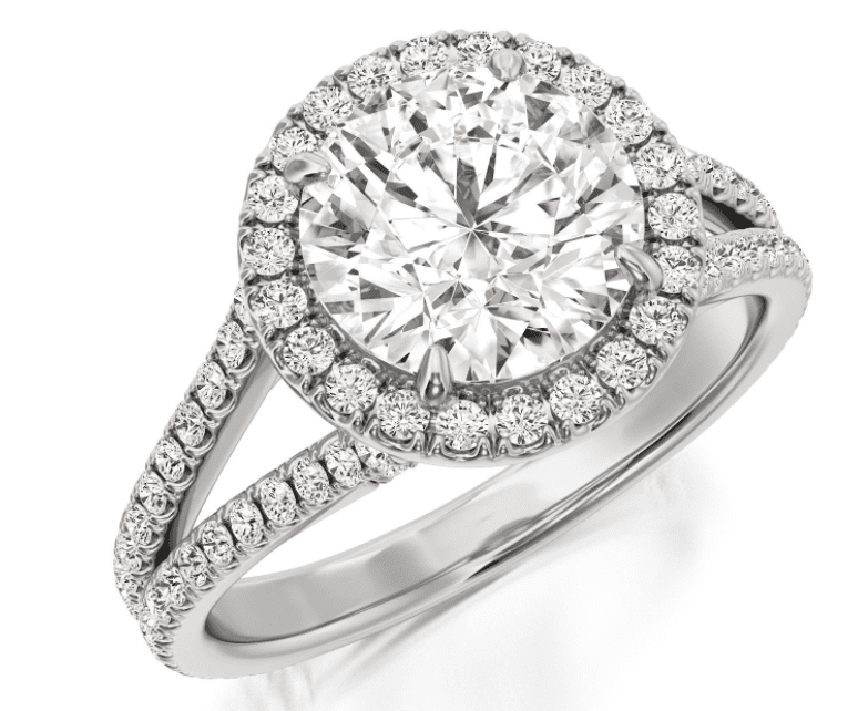 A split shank diamond ring with a single halo and pave - round center stone