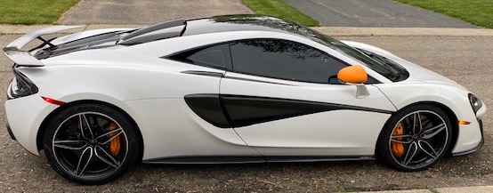 A sleek McLaren parked on a residential street