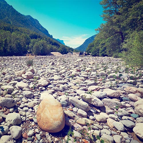 Close-up view of a dried, rocky riverbed