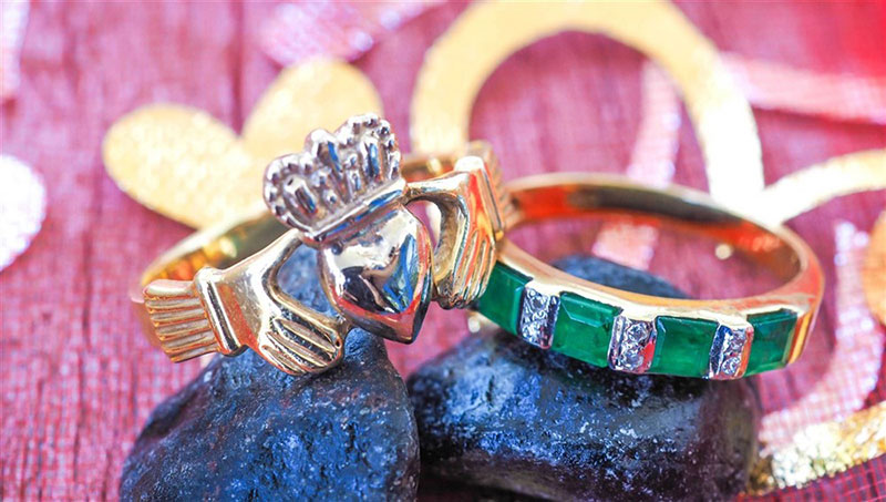 A couple's traditional Claddagh ring set